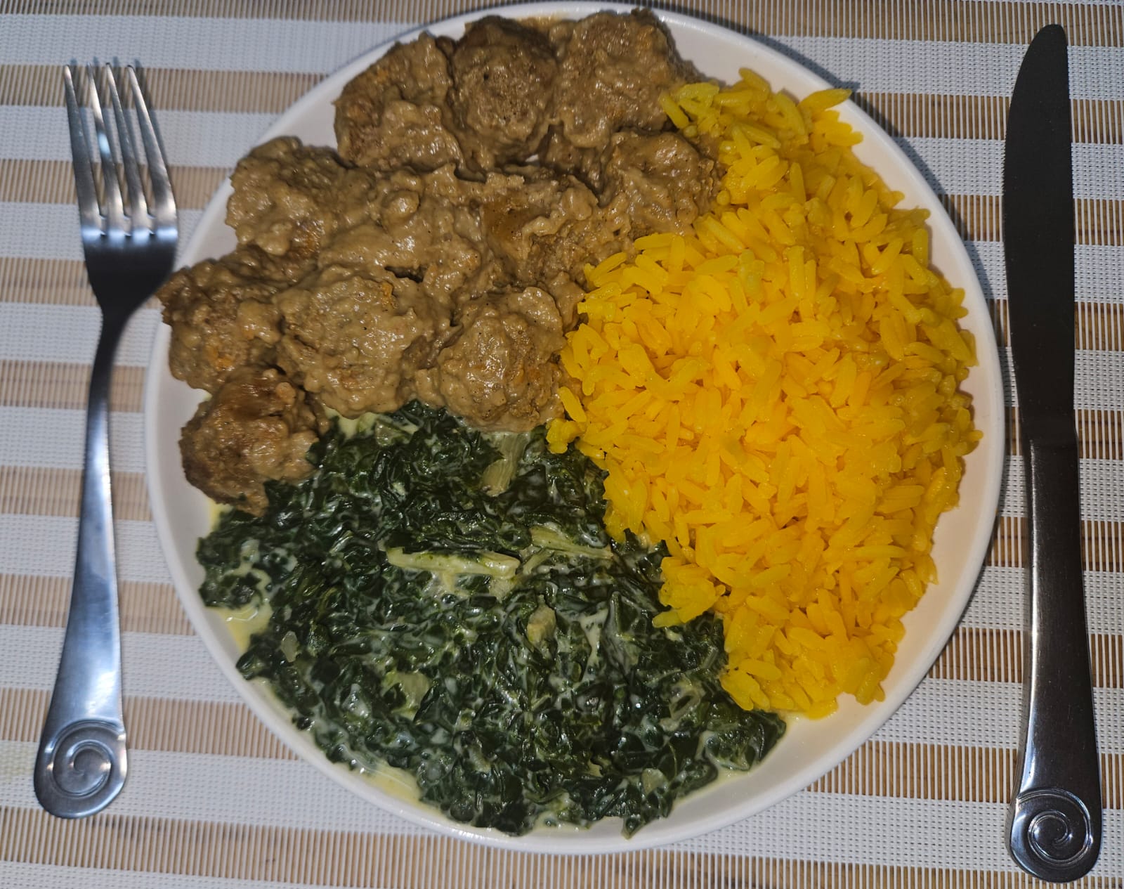 Swedish meatballs with yellow rice and creamed spinach